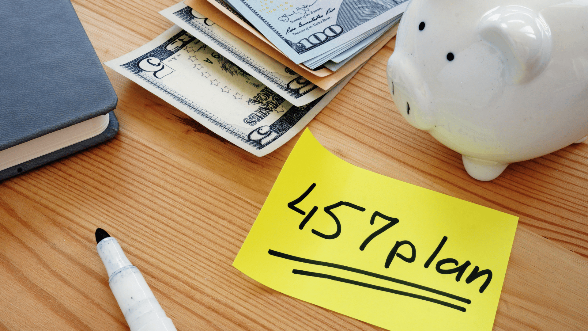 a marker some money and a piggy bank for 457b retirement