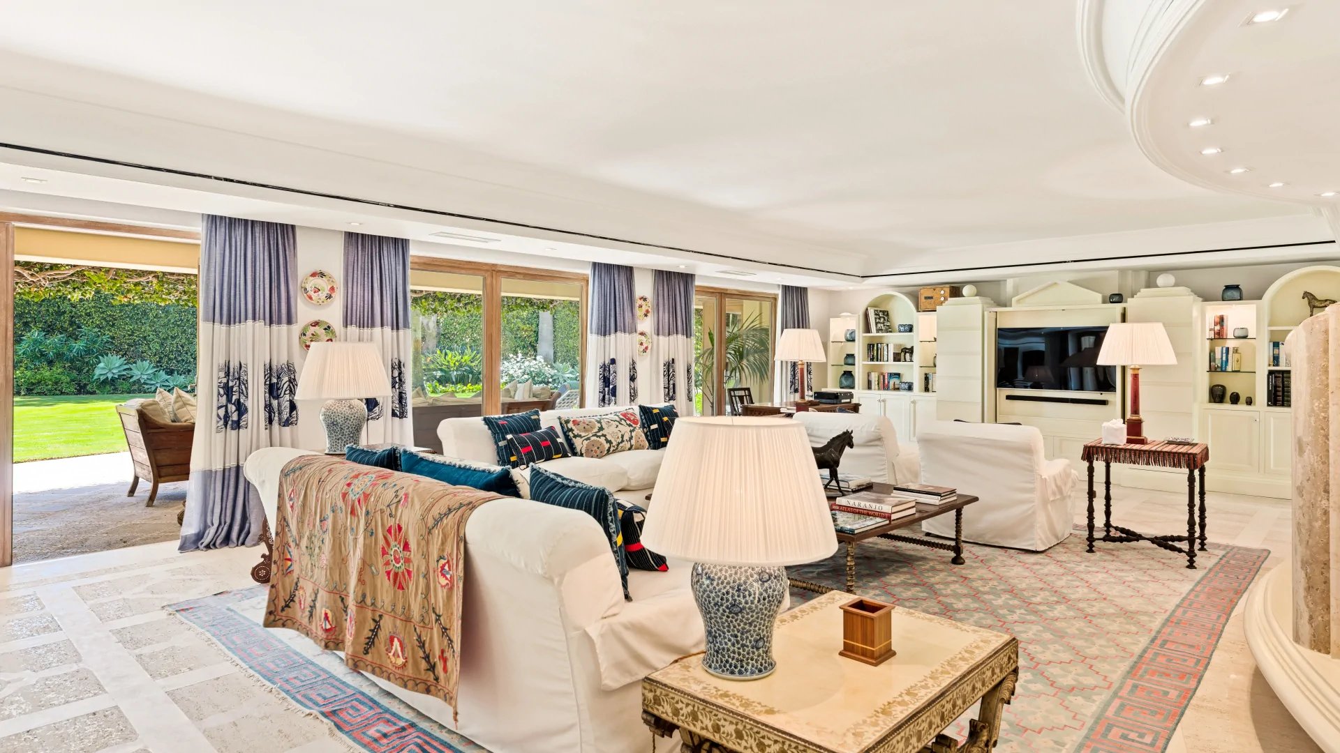 Spacious living room opening to garden in Marbella villa