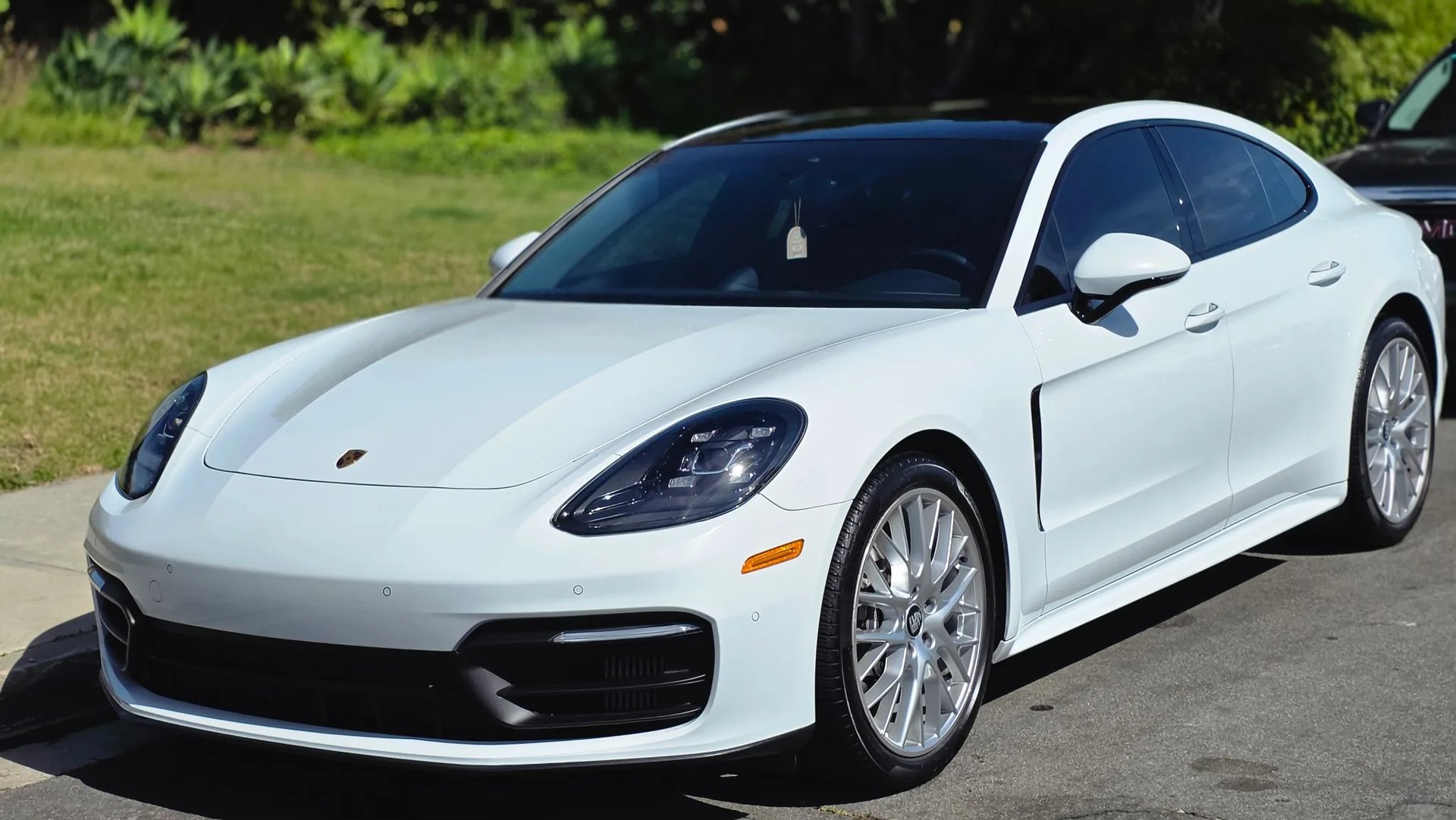 Professional mobile auto detailing in North County San Diego featuring a freshly detailed white luxury sedan.