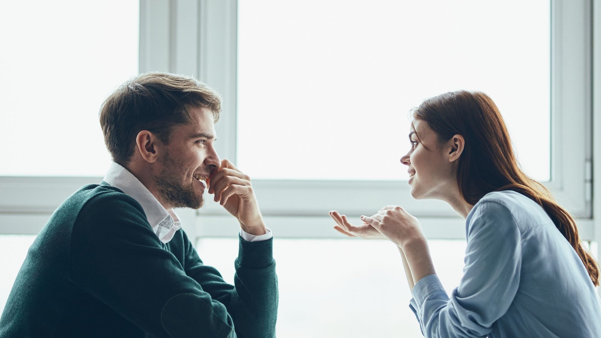 a man and woman sharing a meal at a restaurant