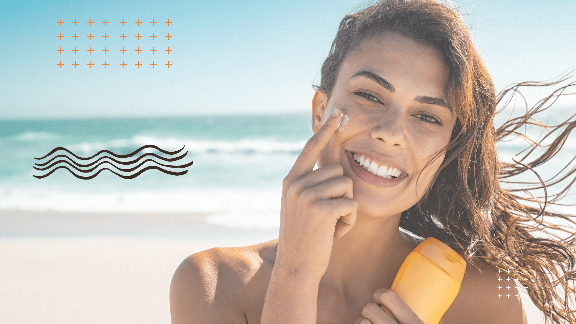 Smiling woman applying facial sunscreen at the beach for summer skin protection.