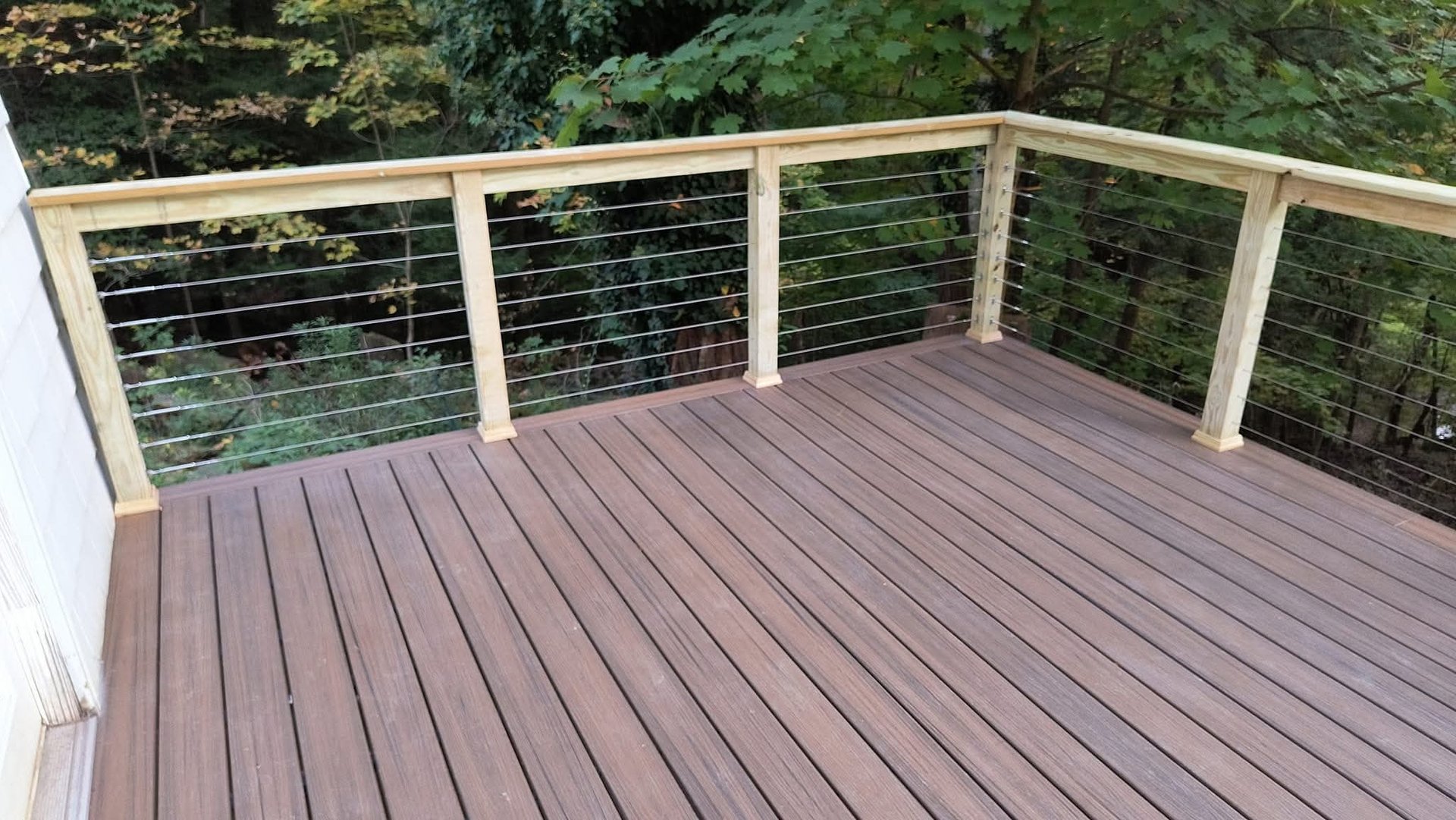 Close-up of natural wood deck railing showing craftsmanship and clean construction details