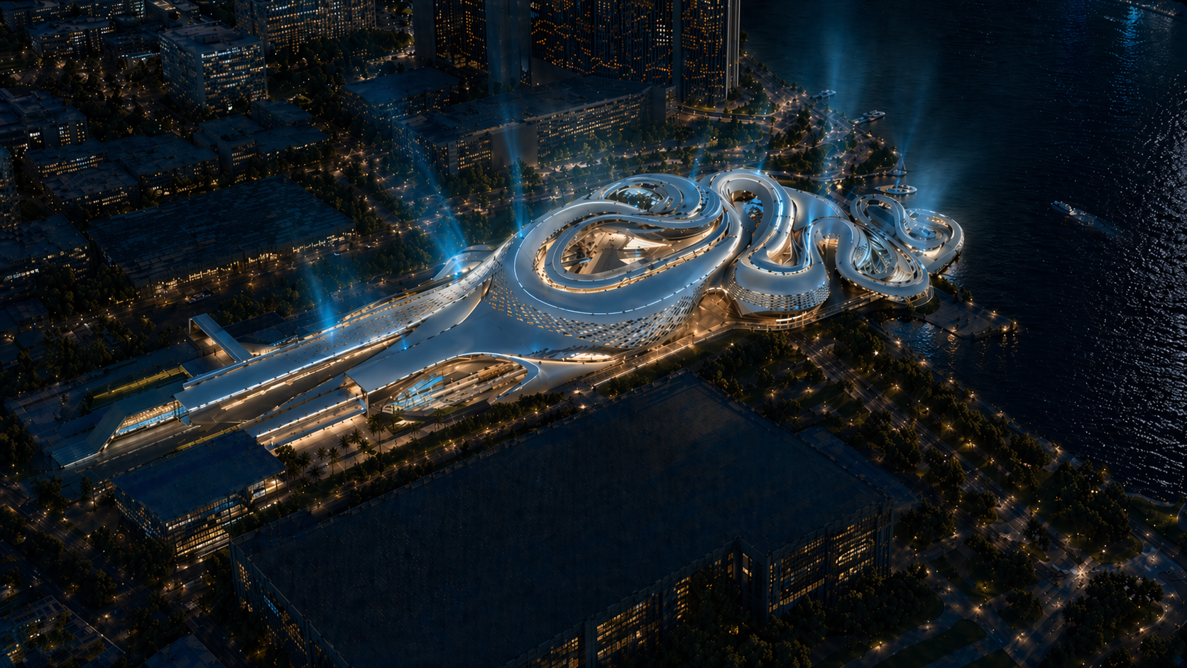 Aerial night view of a futuristic waterfront building with organic curves and glowing lights.