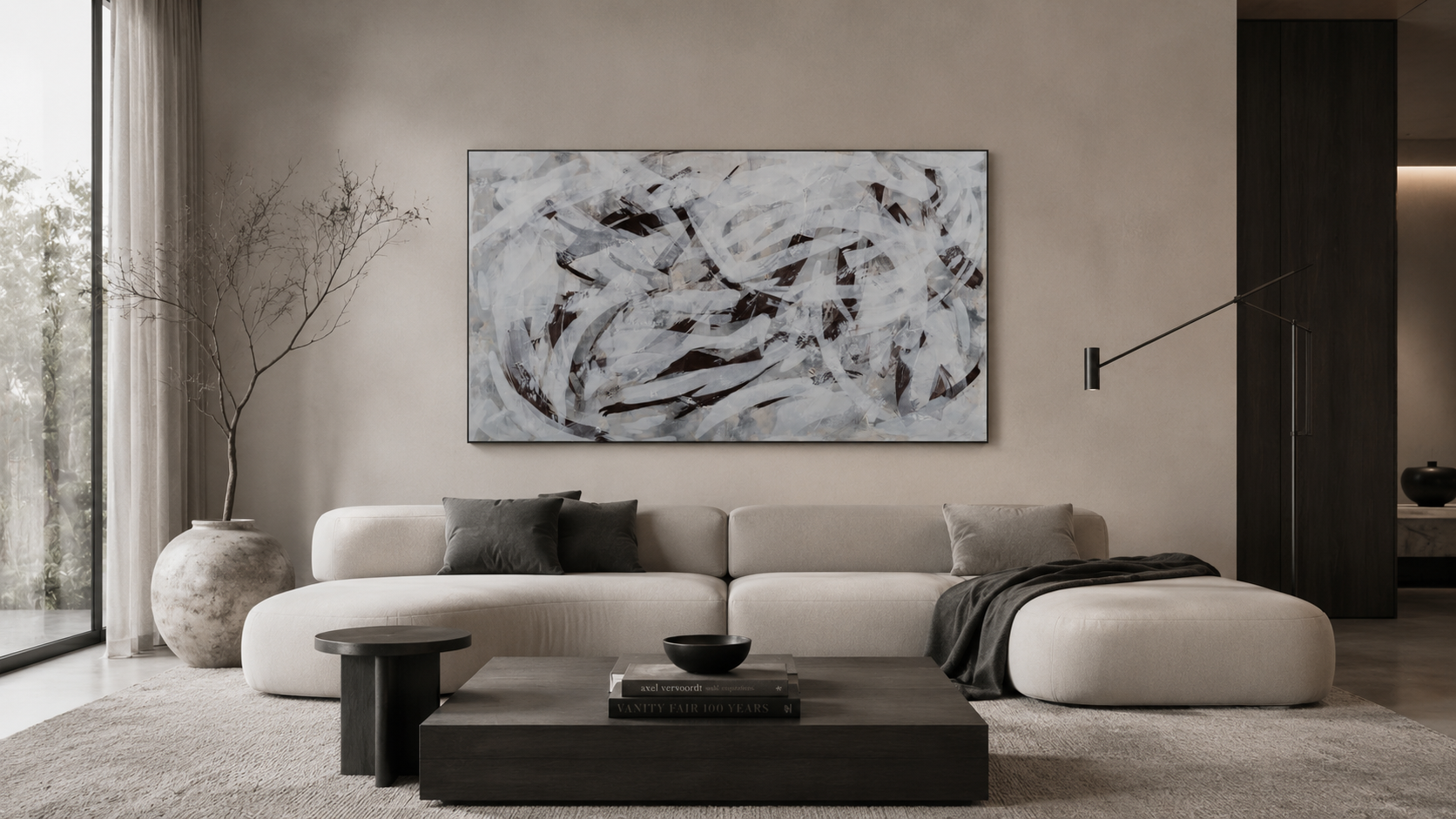 Modern minimalist living room with a white curved sofa and large abstract wall art.