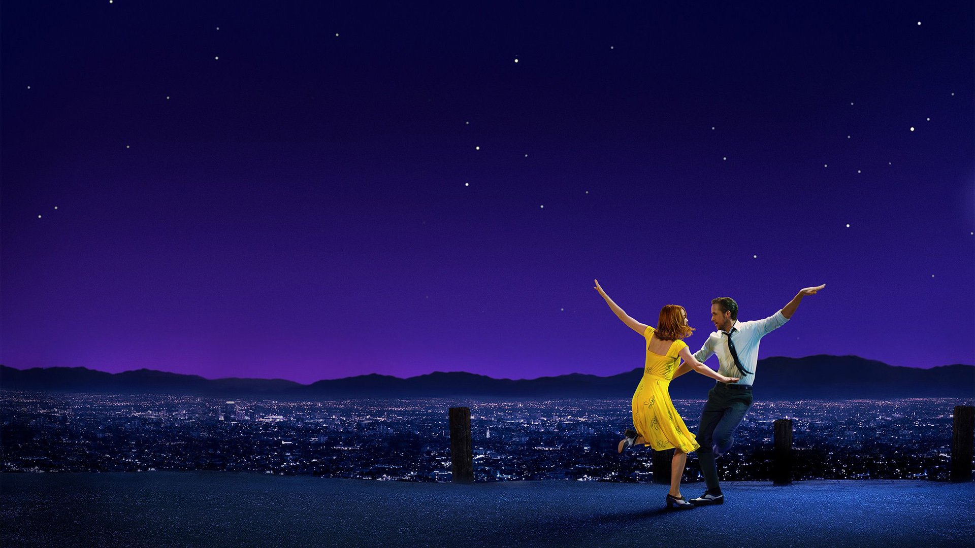 Stone and Gosling dance in silhouette against a city skyline in La La Land (2016)