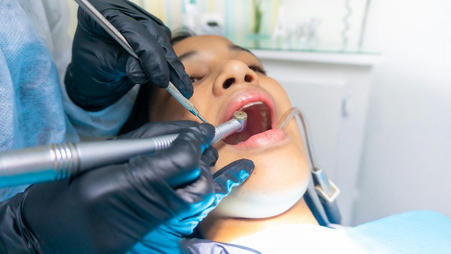 Orthodontist reviewing Invisalign treatment with a patient in a Colorado Springs orthodontic office