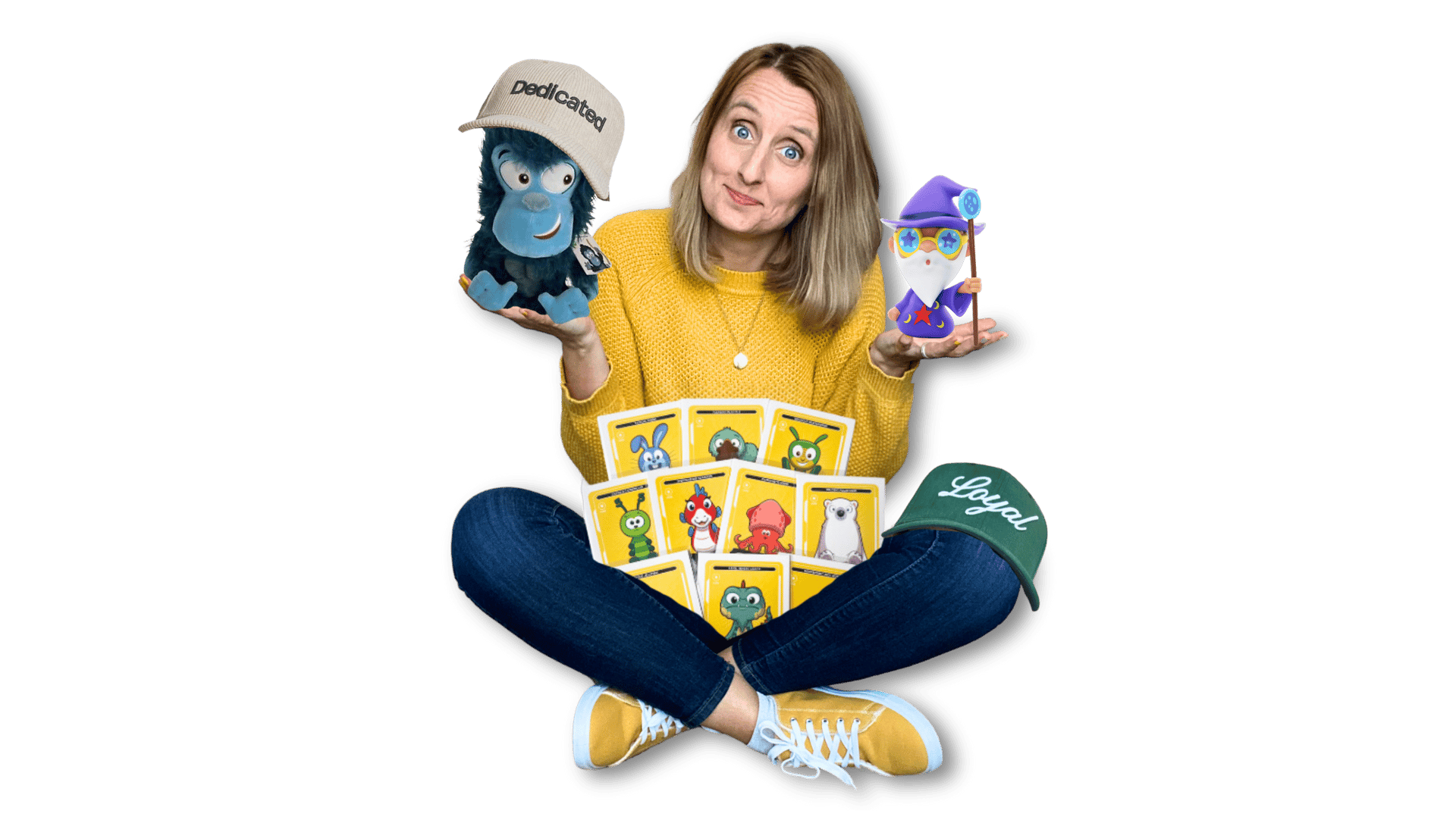 Anne Bagg holding physical Veefriends collectibles like friendscaps, plushies, trading cards, figure