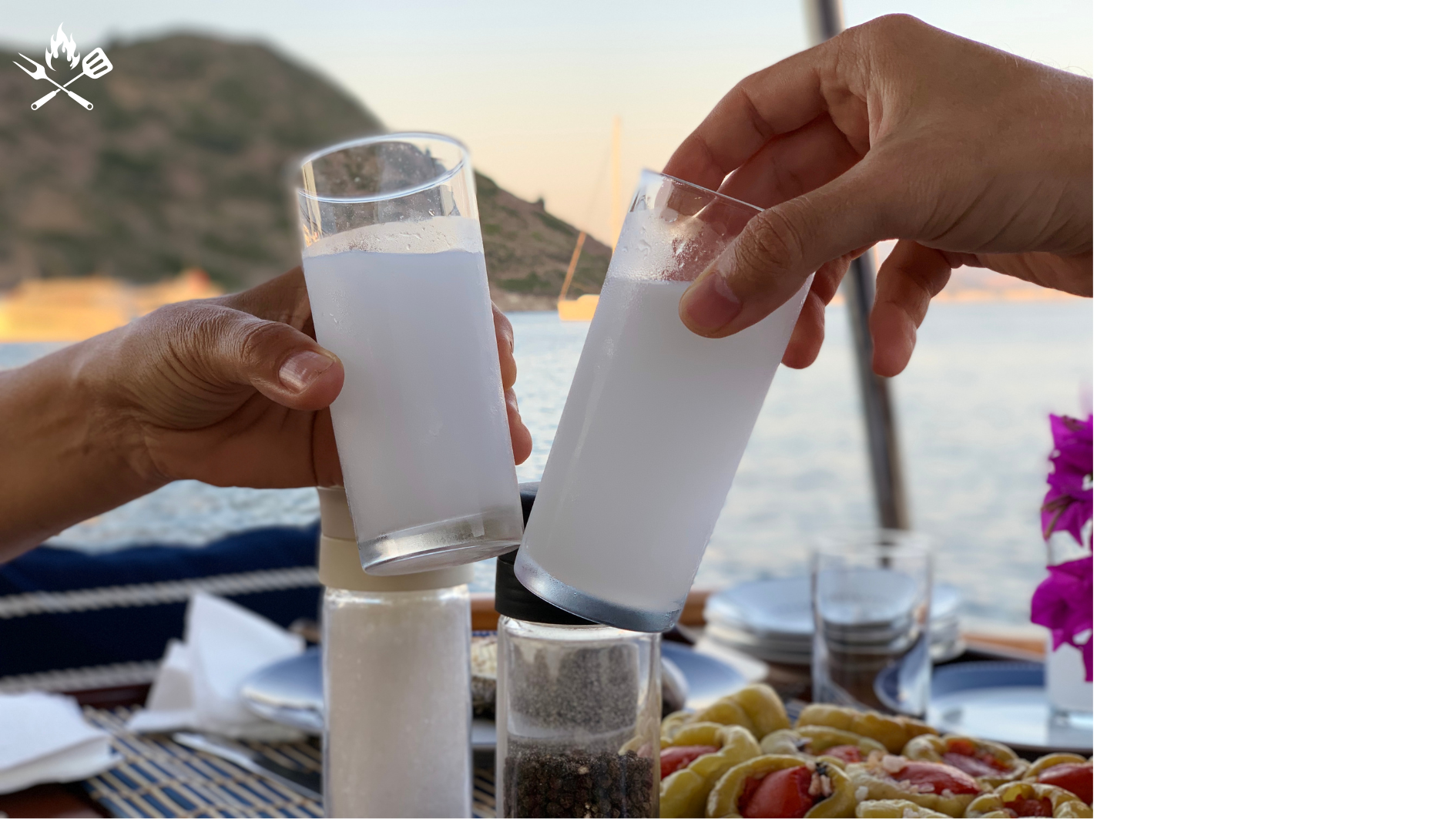 two people toasting Turkish Rakı glasses