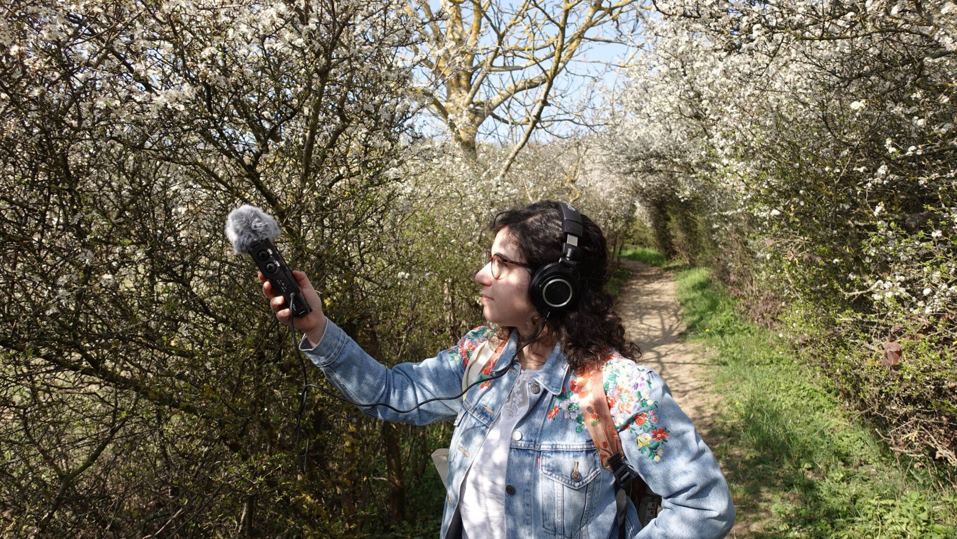 Federica doing some field recording in a forest