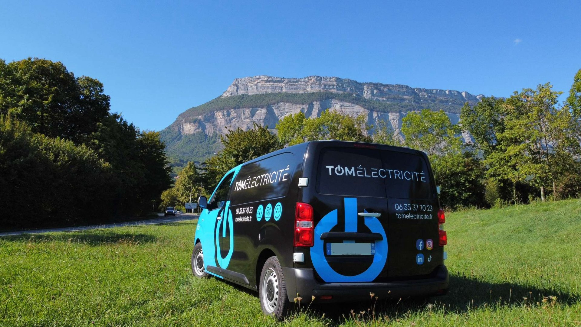 a van with a blue and white sign on it