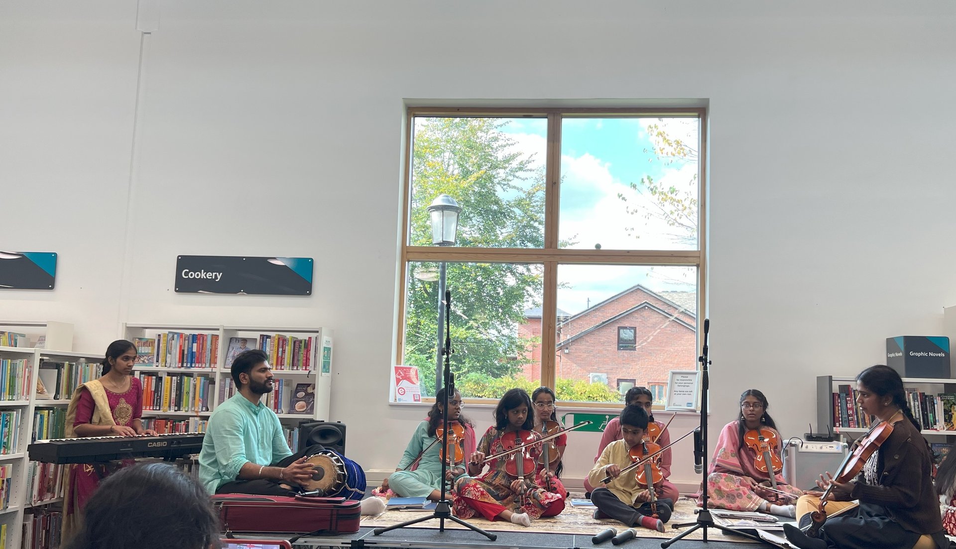 A picture of children performing in library