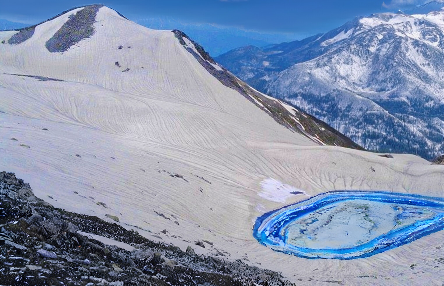 a mountain scene with Ansoo lake and a mountain in the background