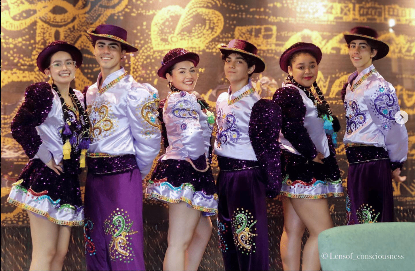 a group of young people in colorful costumes