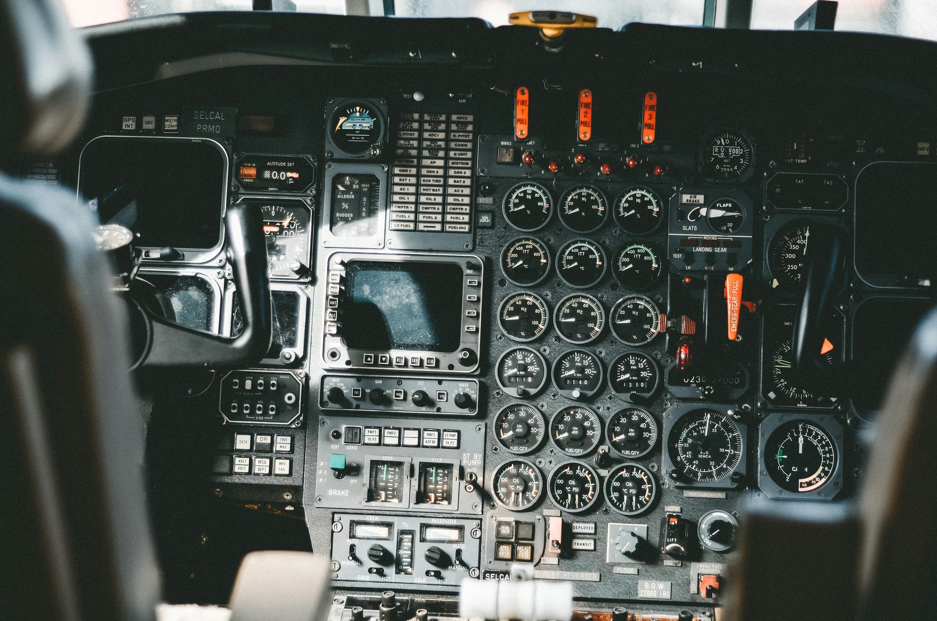 Glass cockpit of a medium aircraft displaying several avionics instruments