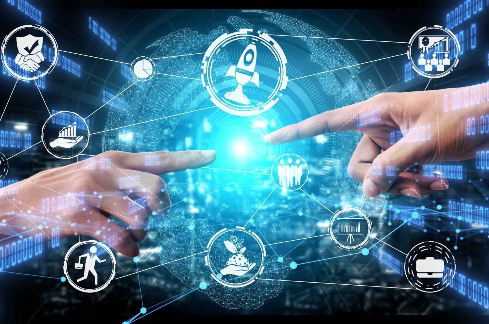 two hands touching a finger on a digital display - Illford Academy