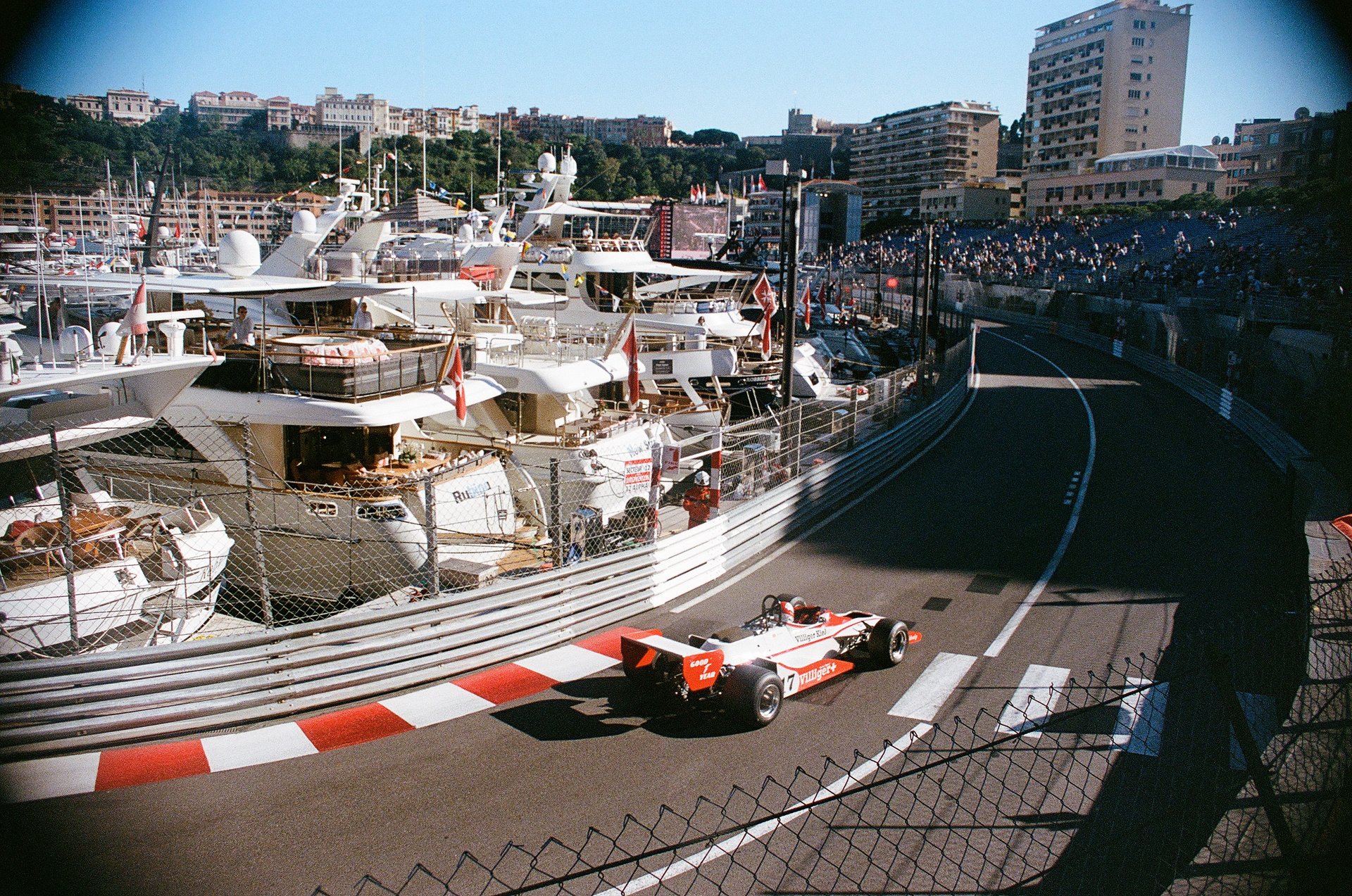 an 80's Formula 1 car on a race track at Monaco