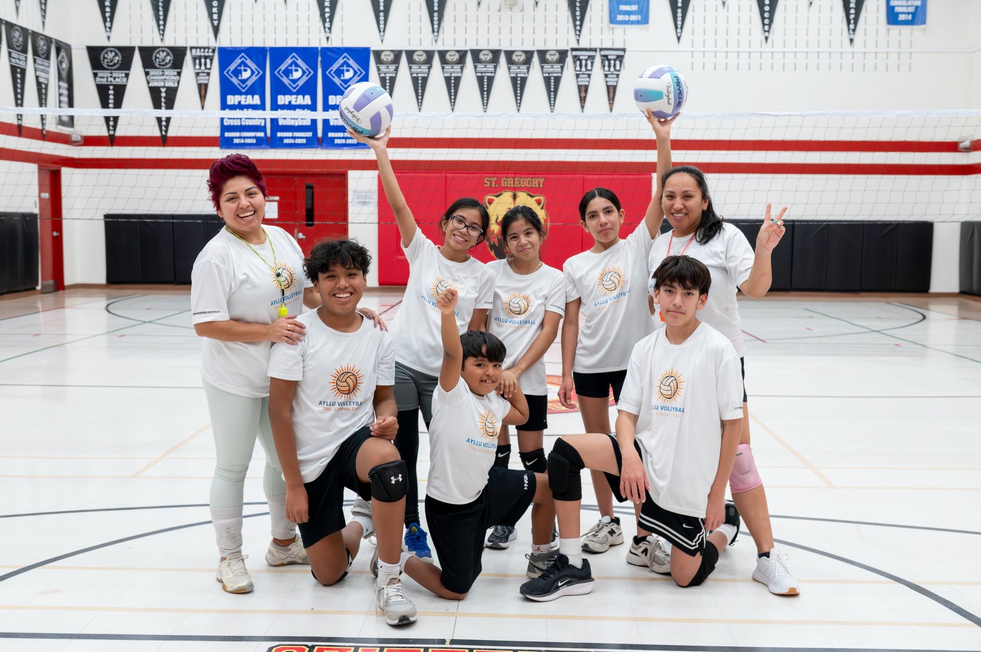 children participating in volleyball activities at outdoor summer camp