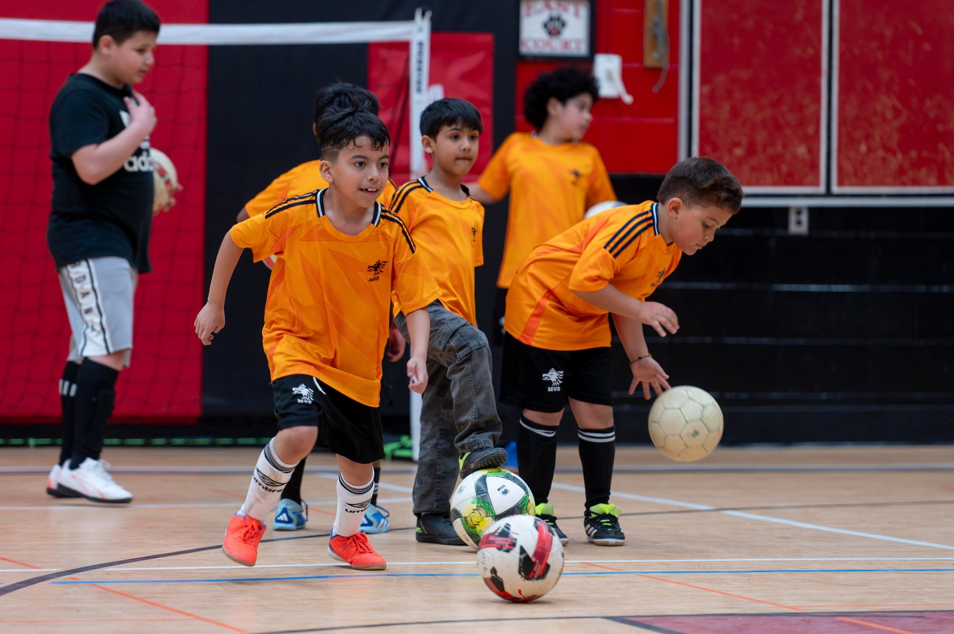 MVB FC players practice soccer drills and ball control at an indoor in soccer school in Mississauga