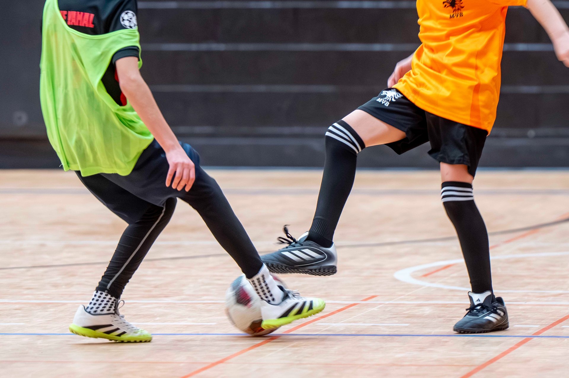 Child practicing fun soccer exercises at home to improve ball control