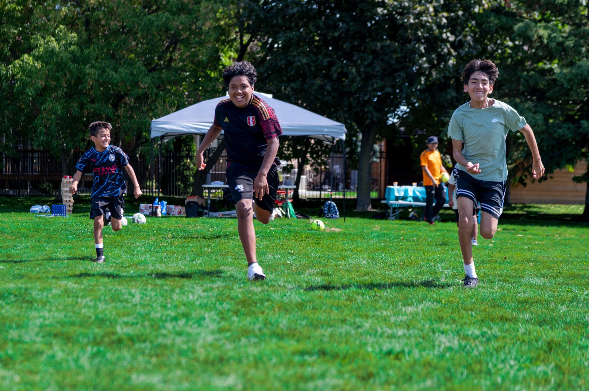 outdoor summer camp for kids playing soccer in Mississauga