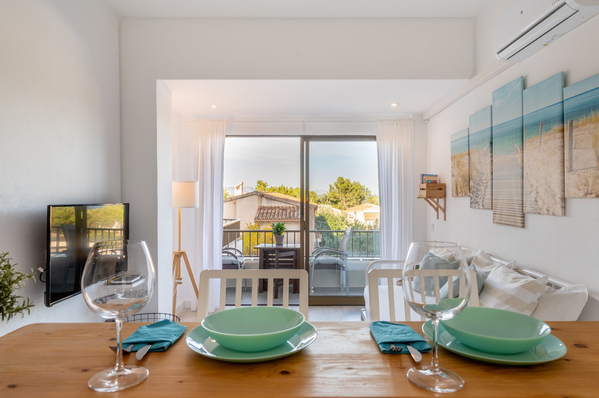 a dining table with a table setting for two