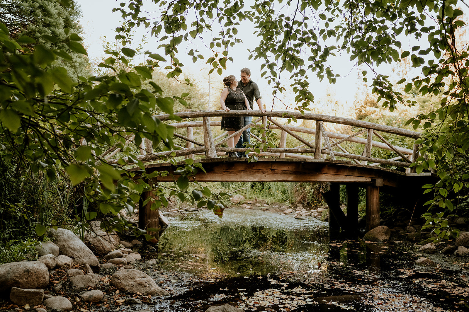 Light house park Engagement photos couple on bridge