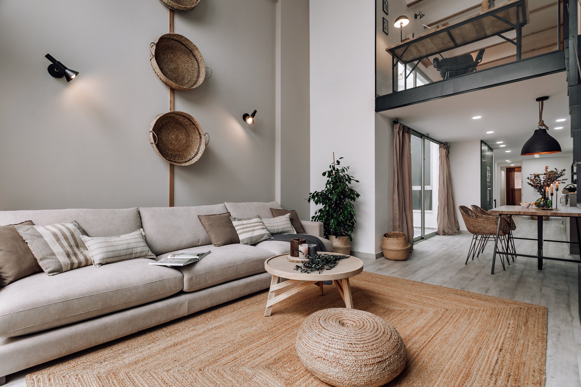 Living area with wooden elements, natural fibers and neutral color palette in Rute interior design