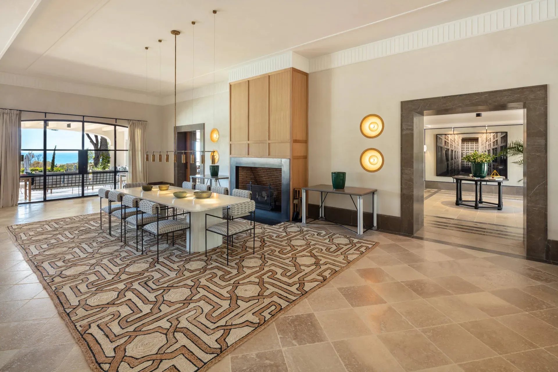 Lounge with patterned floor and dining area at Villa La Gratitud