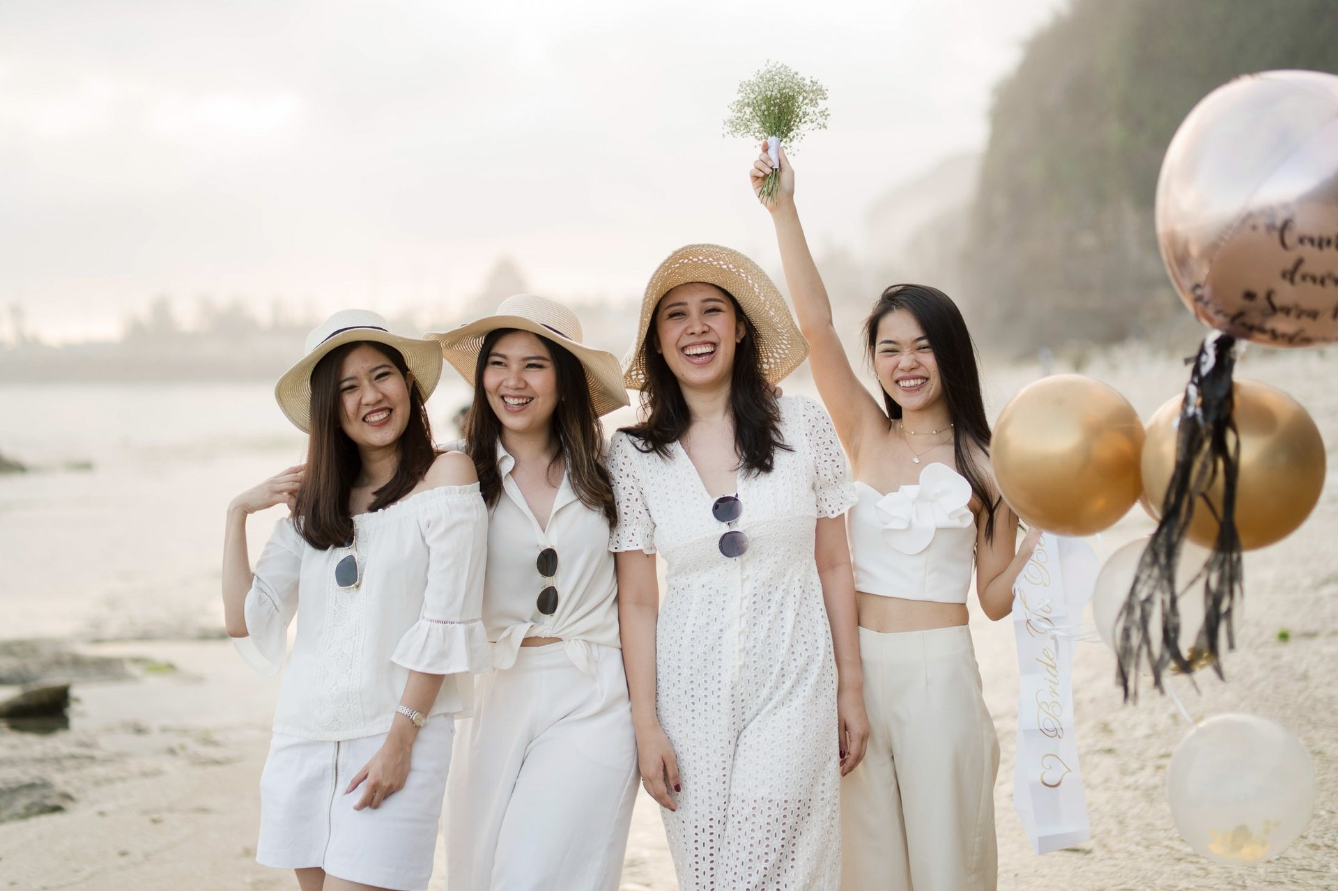 Bachelorette party walking through cliff landscape at Melasti Beach Bali