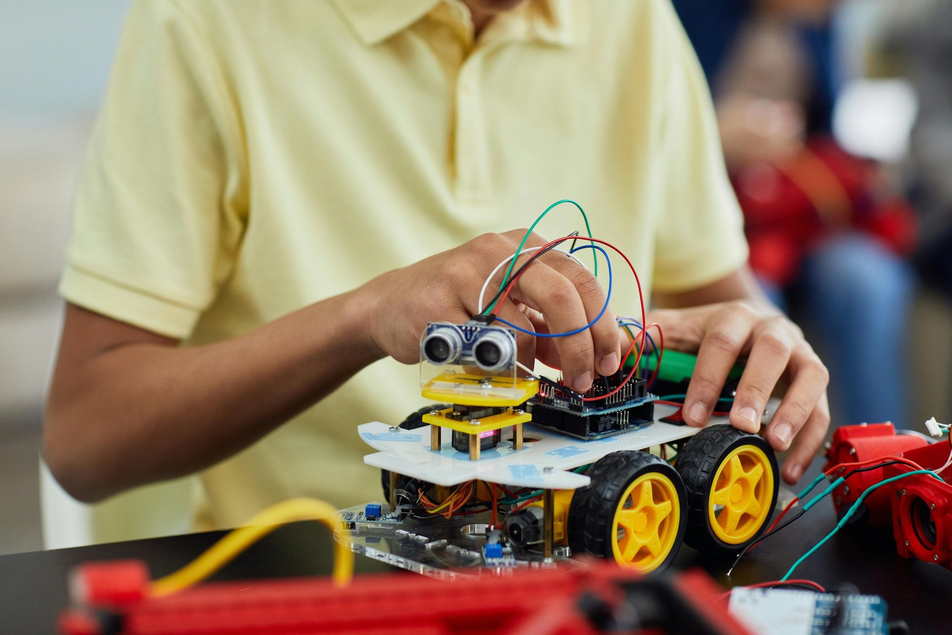 a kid is holding a remote control car