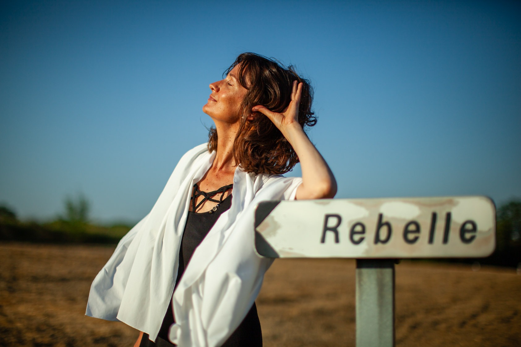 a rebel woman in a white robe