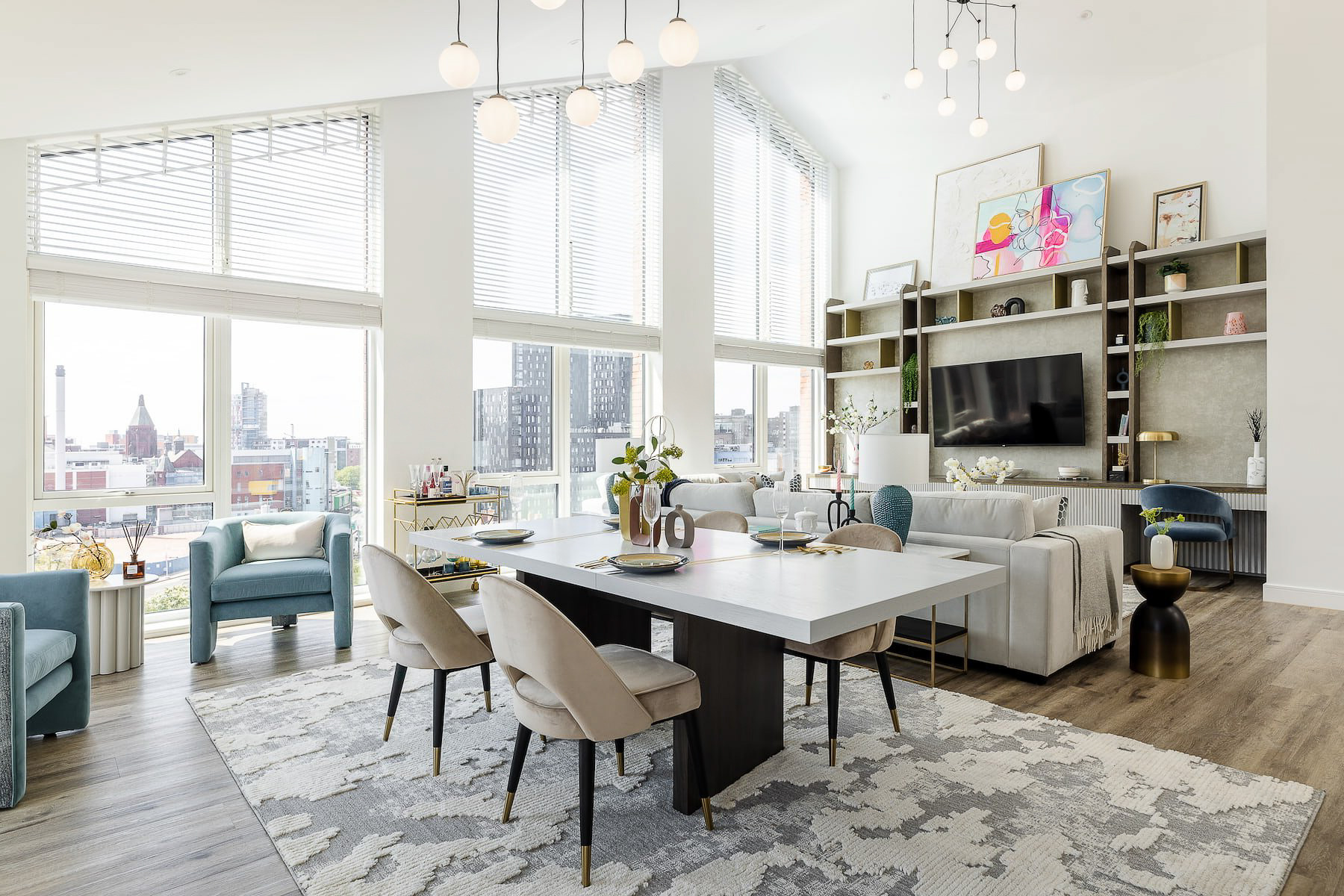 a living room with a large table and chairs