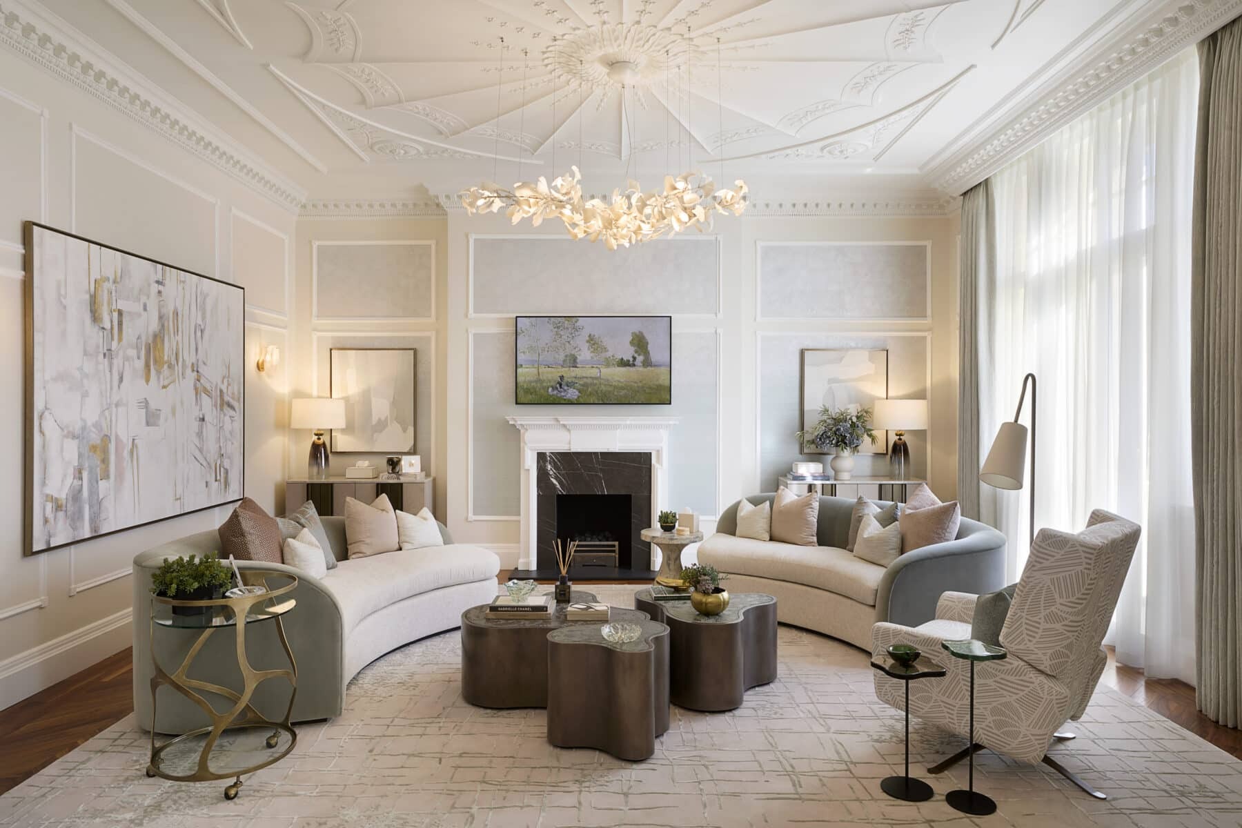 a living room with a couch and a chandelier Nour Nagy Designs London interior Design