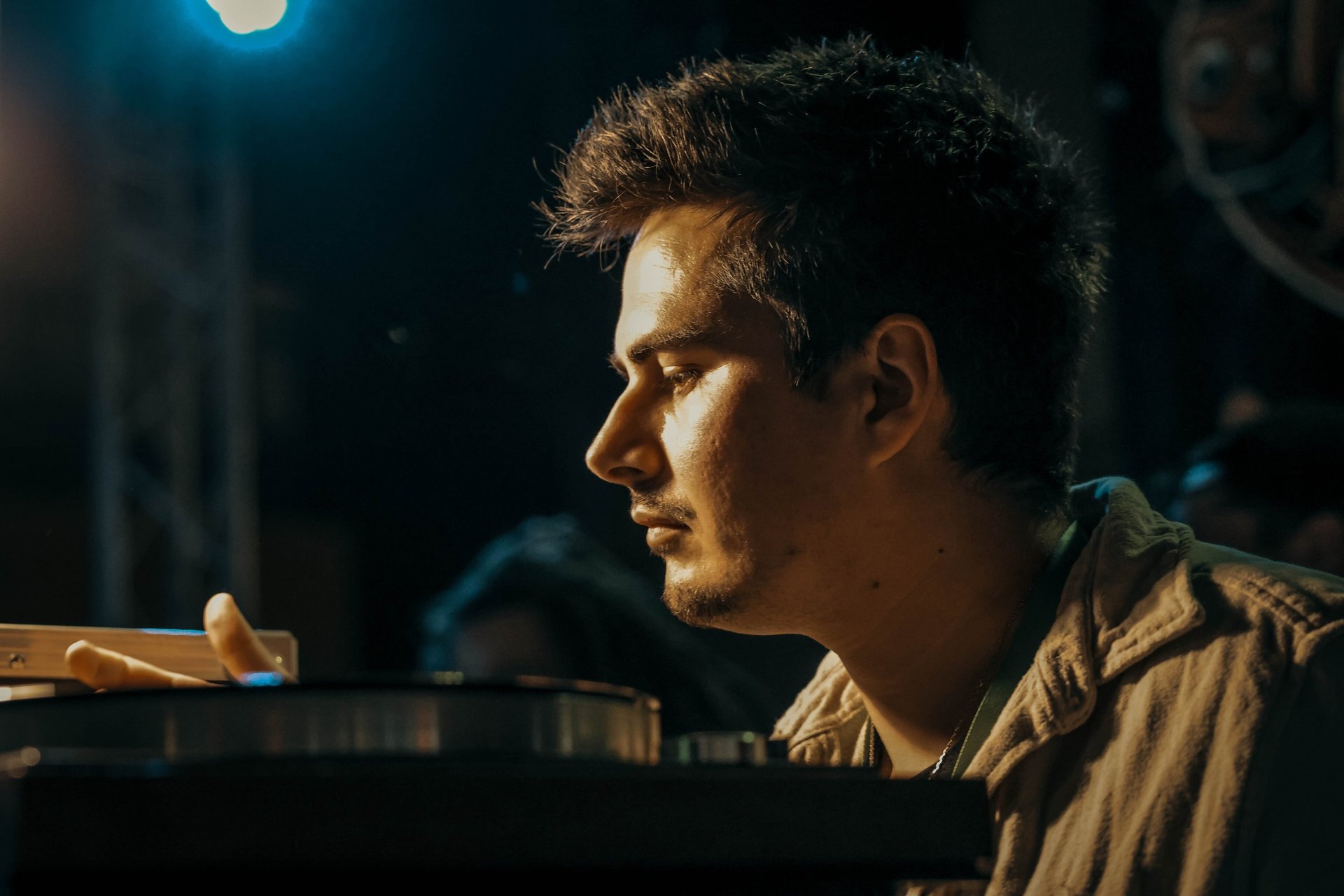 a man sitting at a table with a laptop
