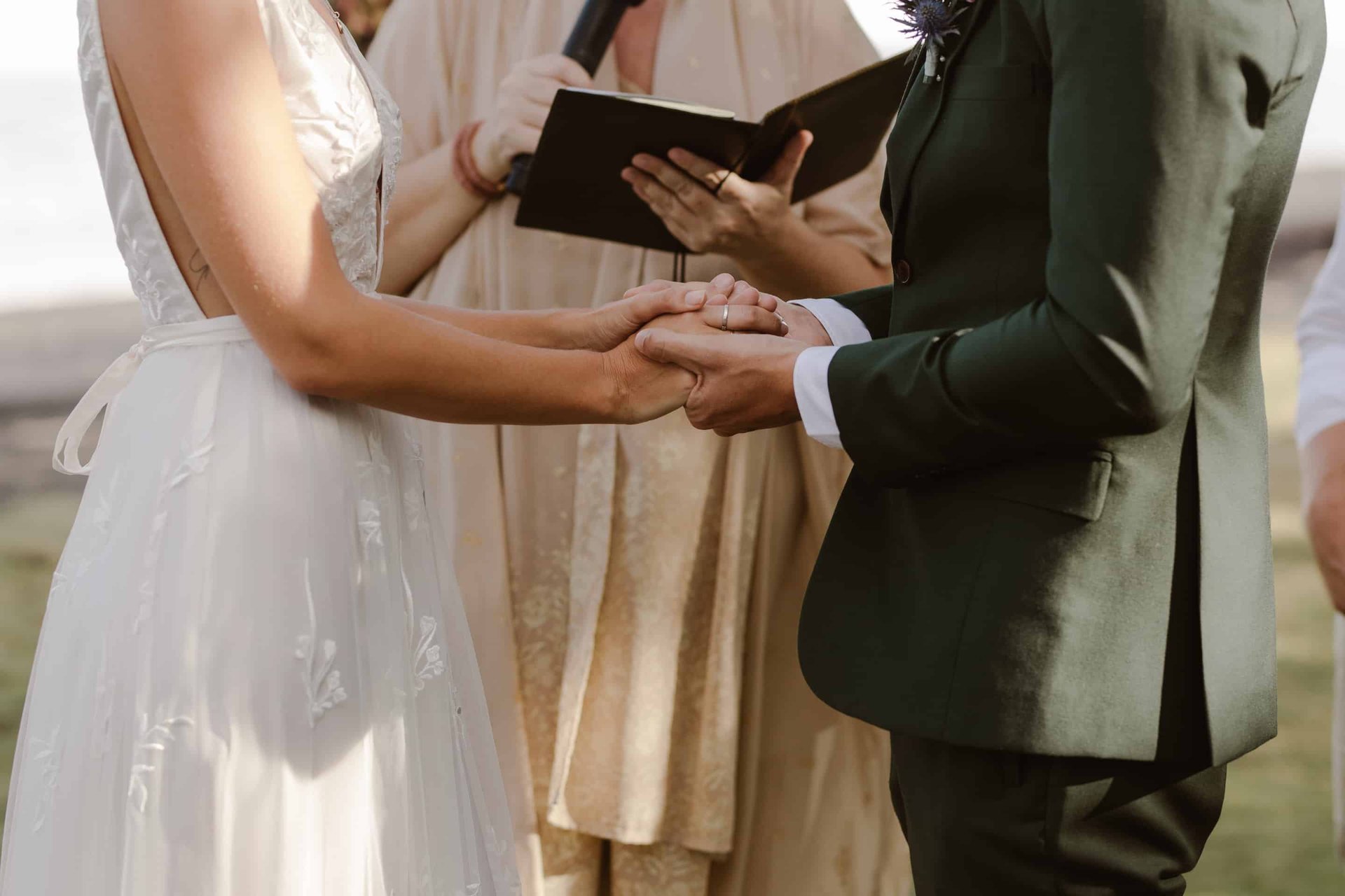 a man and woman holding hands while holding hands