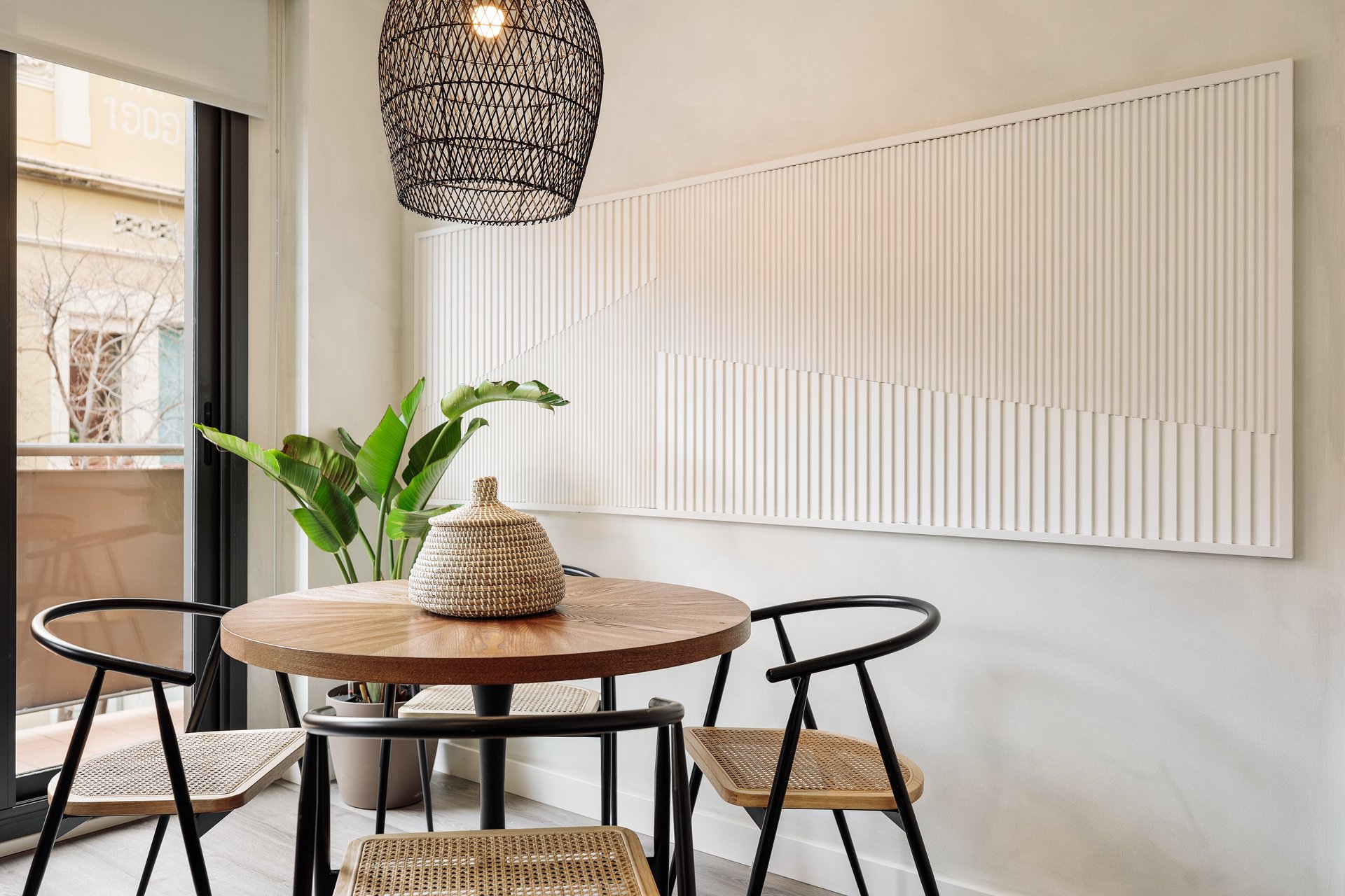 Elegant dining area with bespoke relief wall panels and contemporary furniture and sleek design
