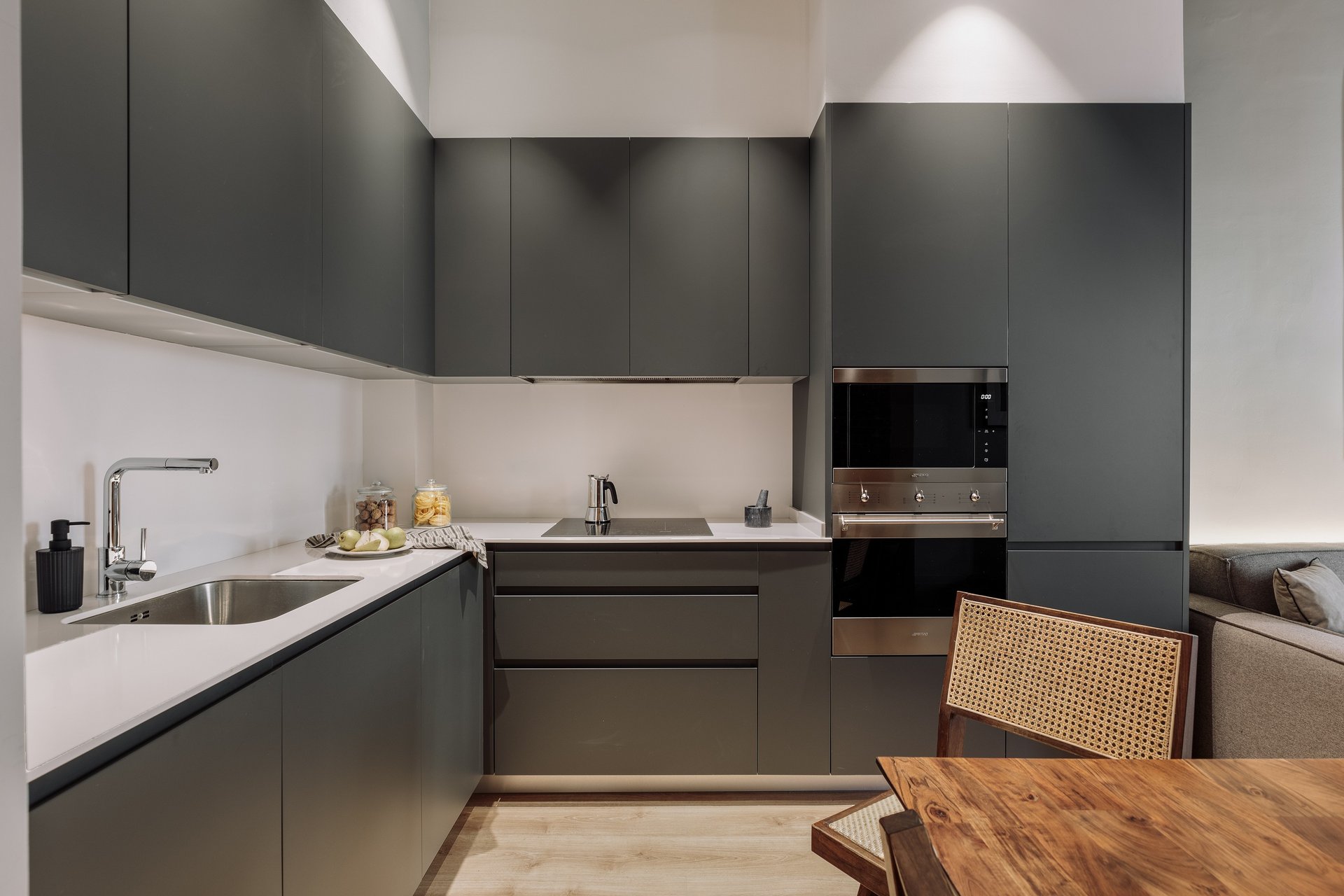 Integrated modern dark grey kitchen with modern design elements and lighting