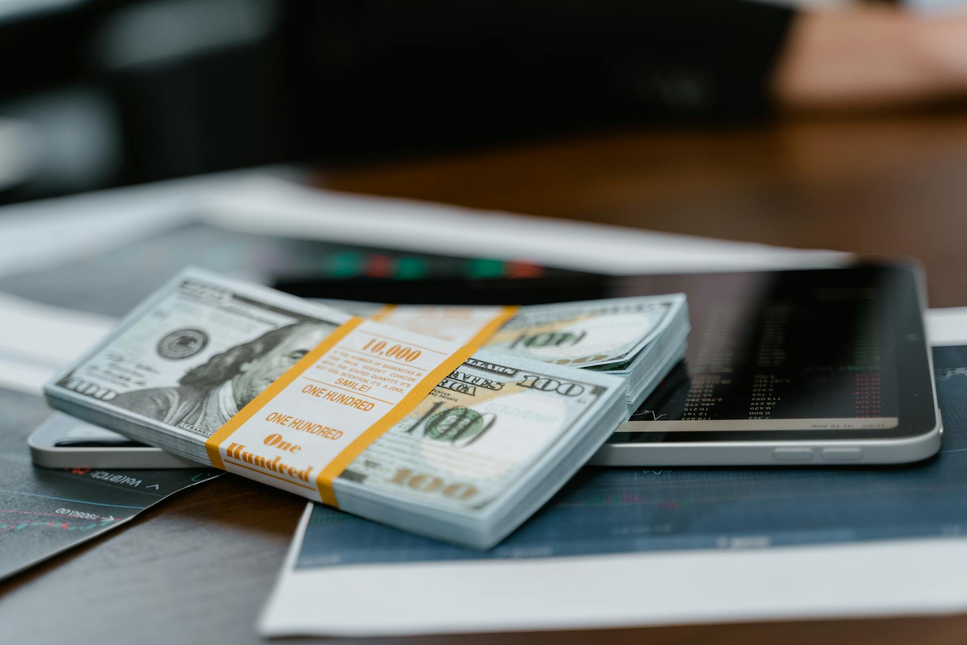 bunch of money and investing charts and graphs