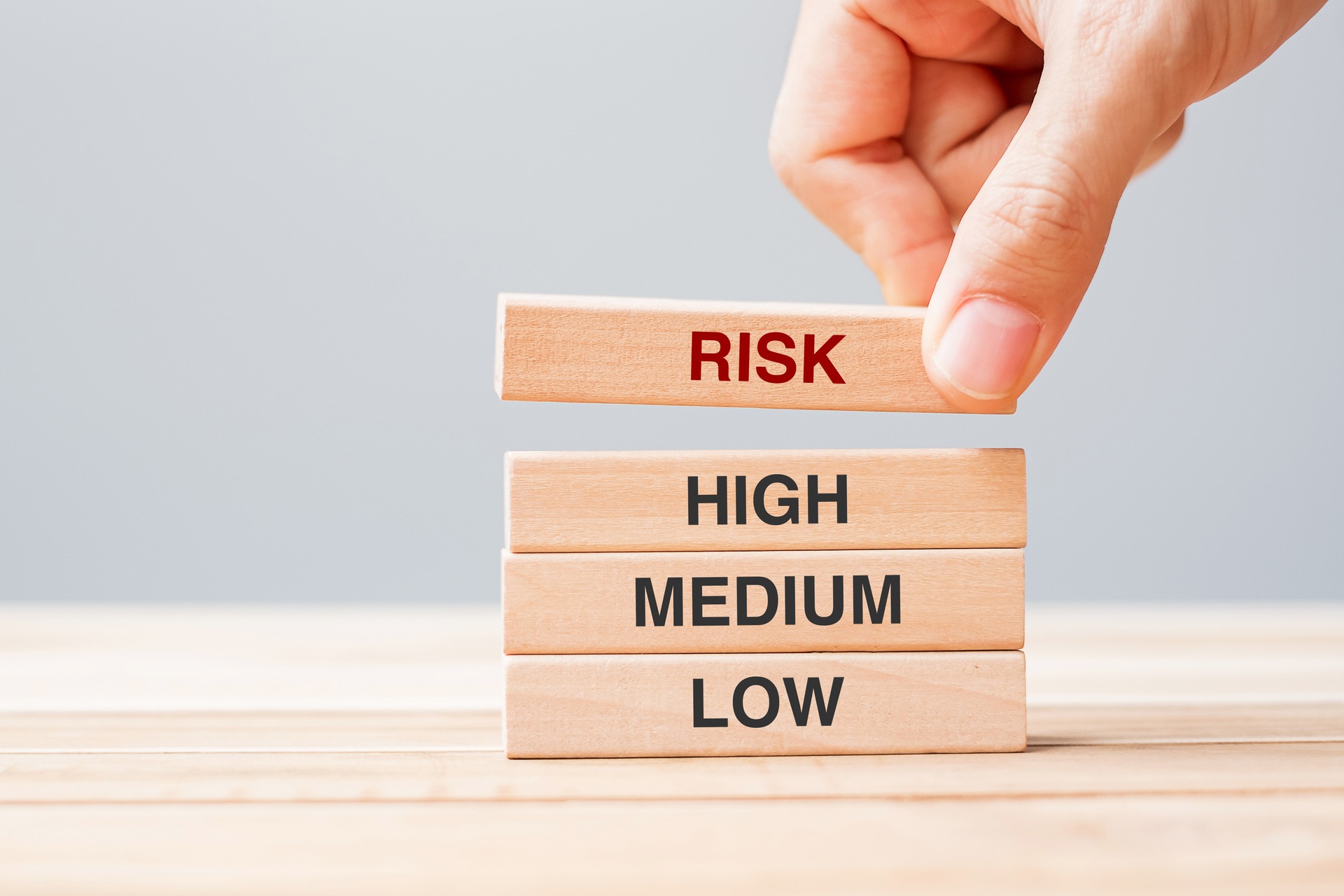 wooden blocks labeled with different risk tolerance levels