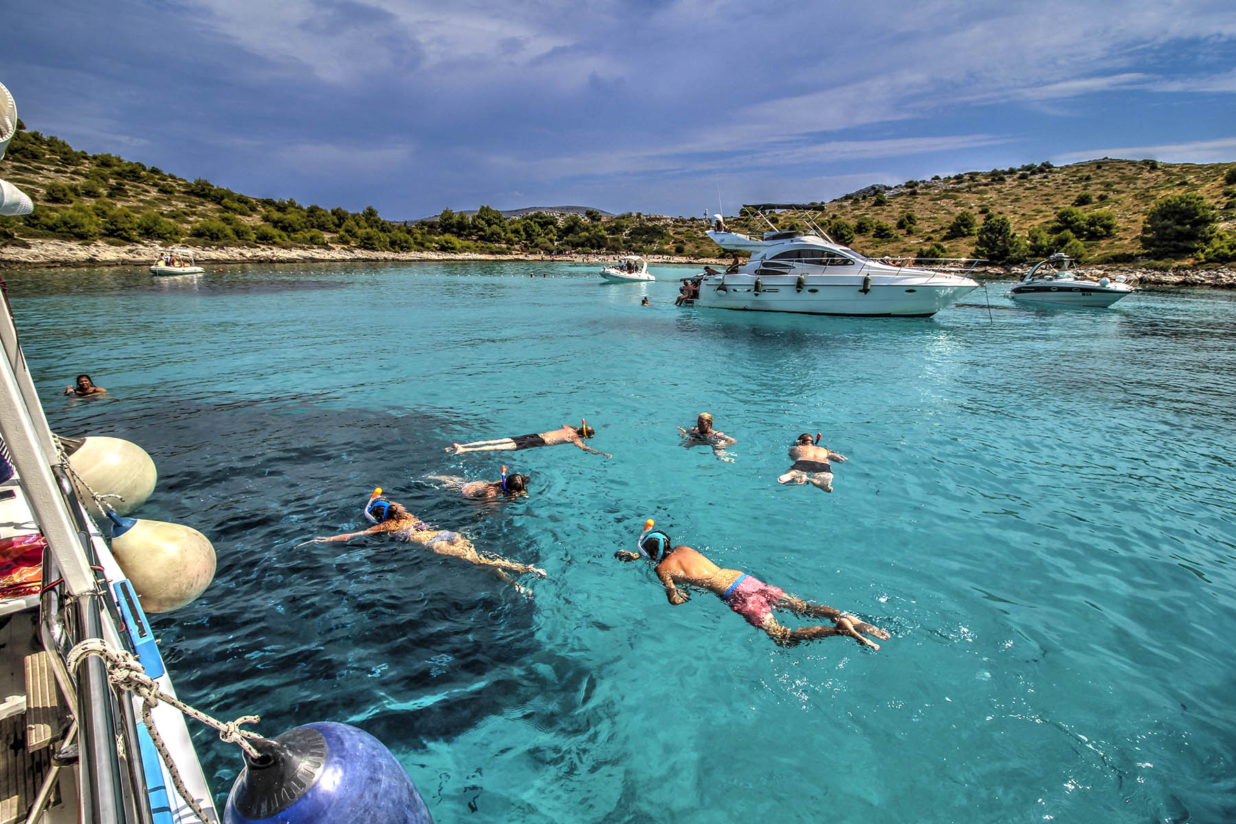 People swimming and snorkling on the Kornati Islands National Park in the Zadar Archipelago.