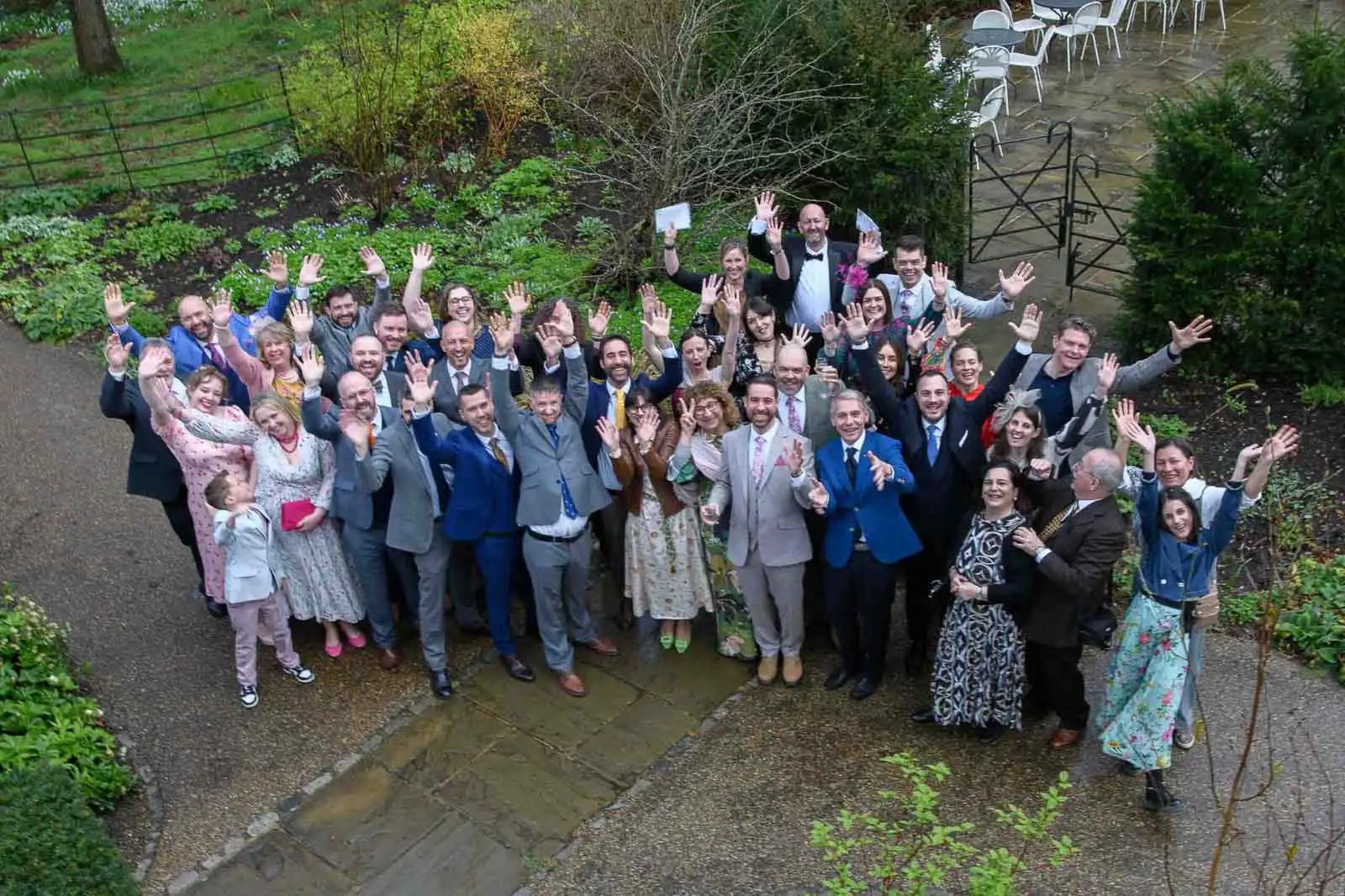 the entire wedding party in the grounds of Pembroke Lodge Richmond