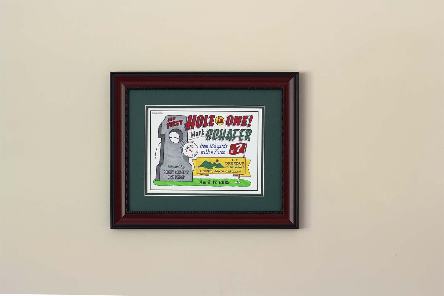 A framed piece of hole-in-one artwork with a ball and the pertinent information about the amazing shot.