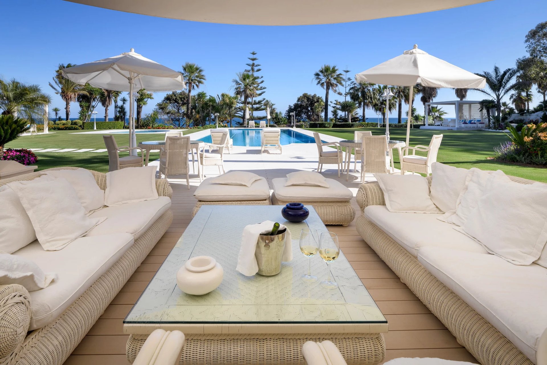 Outdoor lounge area in Marbella beachfront villa