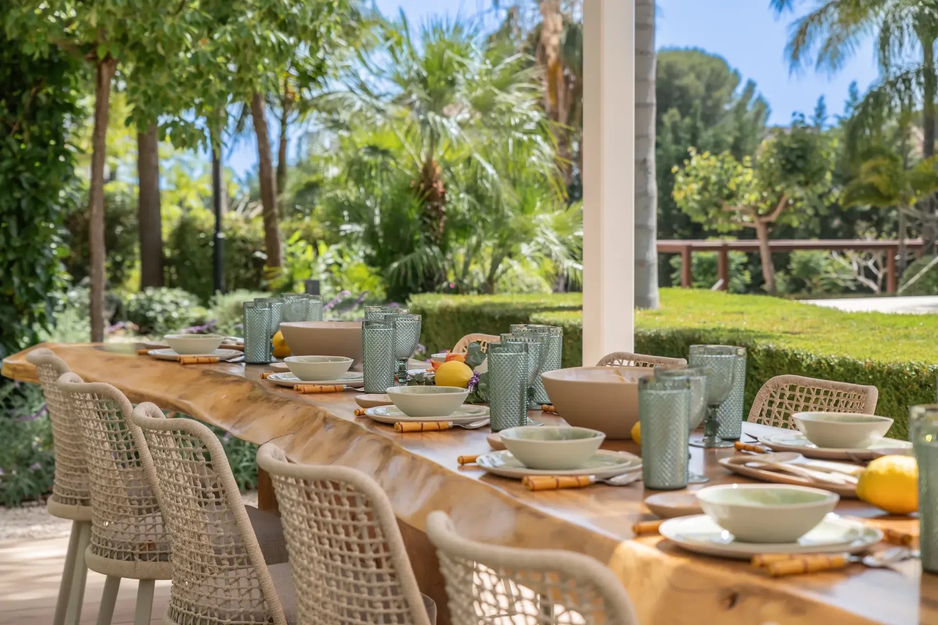 Al fresco dining terrace with wicker chairs at Villa Serenity