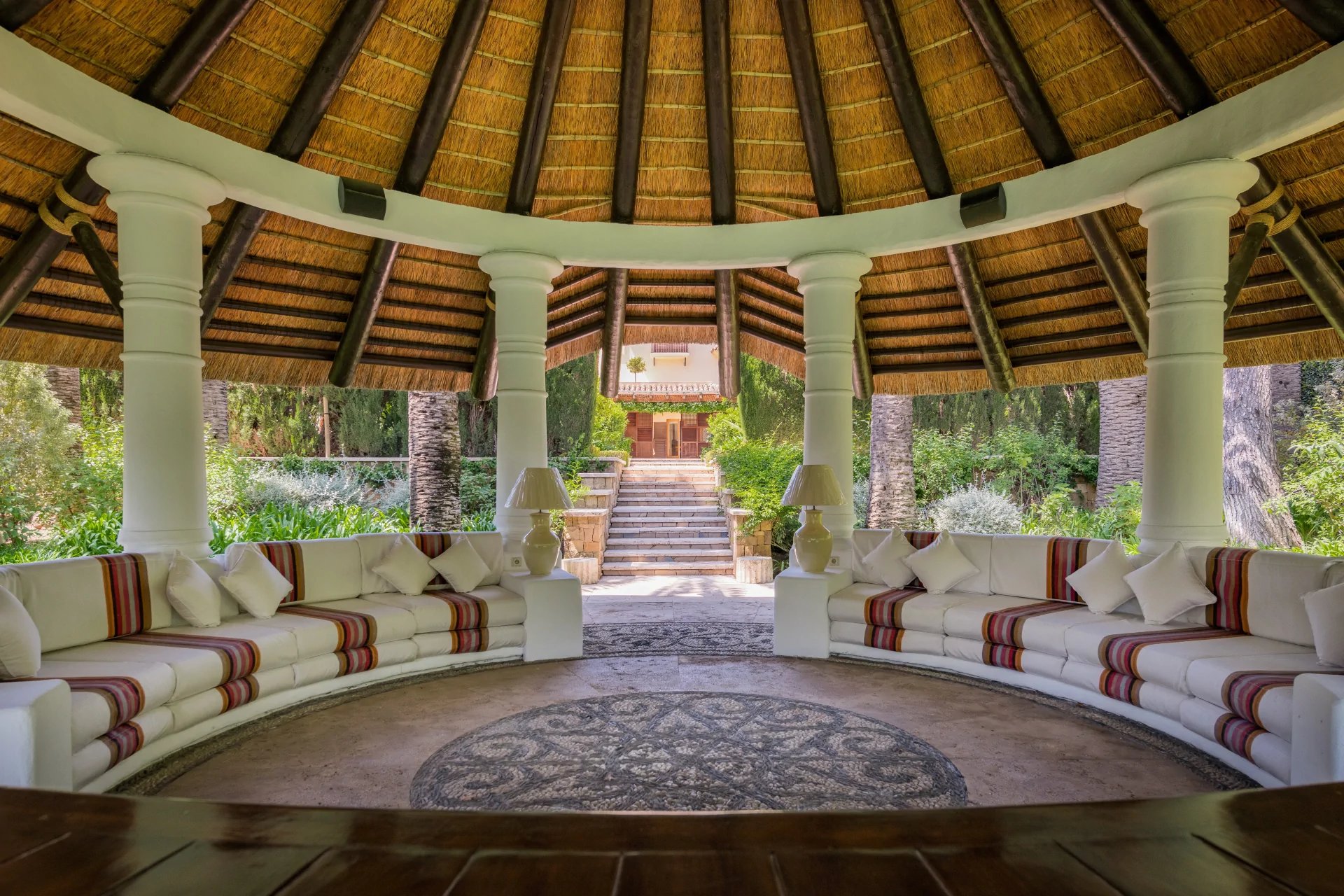 Thatched garden pavilion lounge in Marbella estate