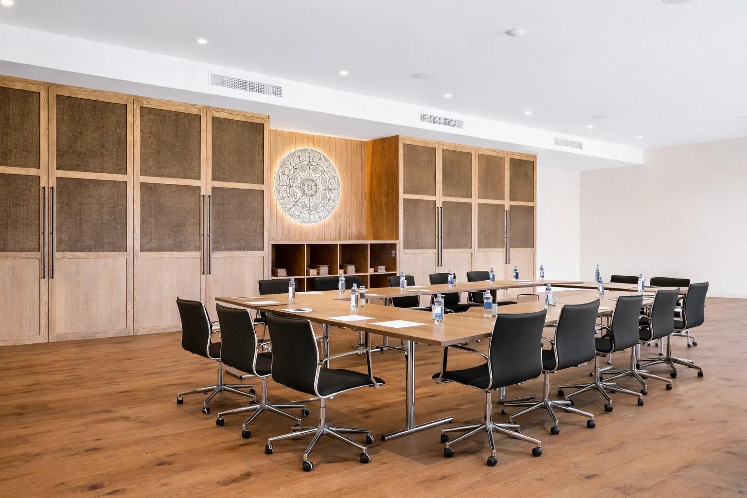 Conference room setup with boardroom table and garden access
