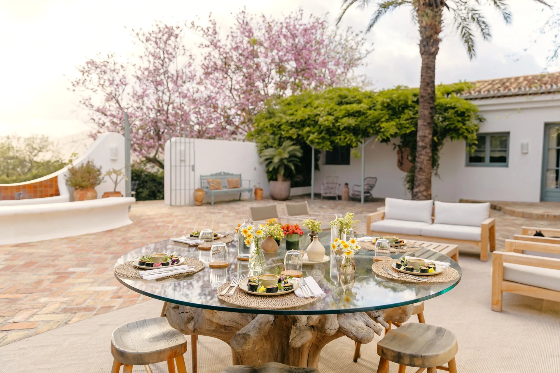 Courtyard dining setting with flowers and Mediterranean details