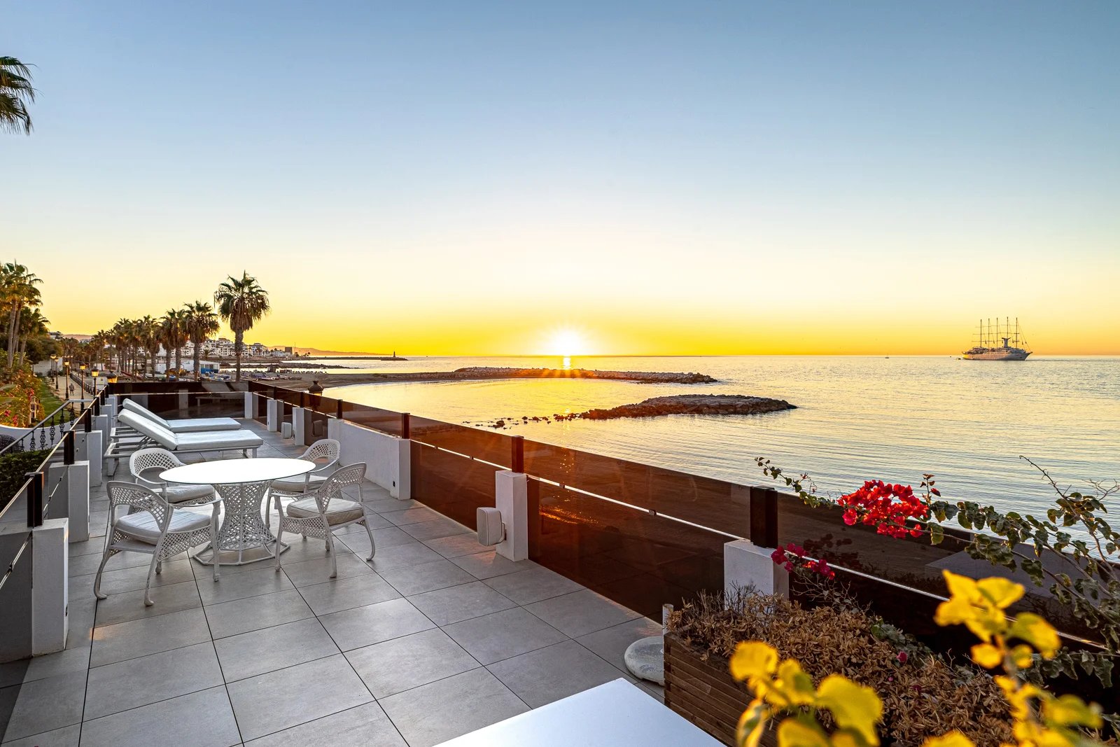 Sunset terrace overlooking the sea in beachfront villa Marbella near Puerto Banus