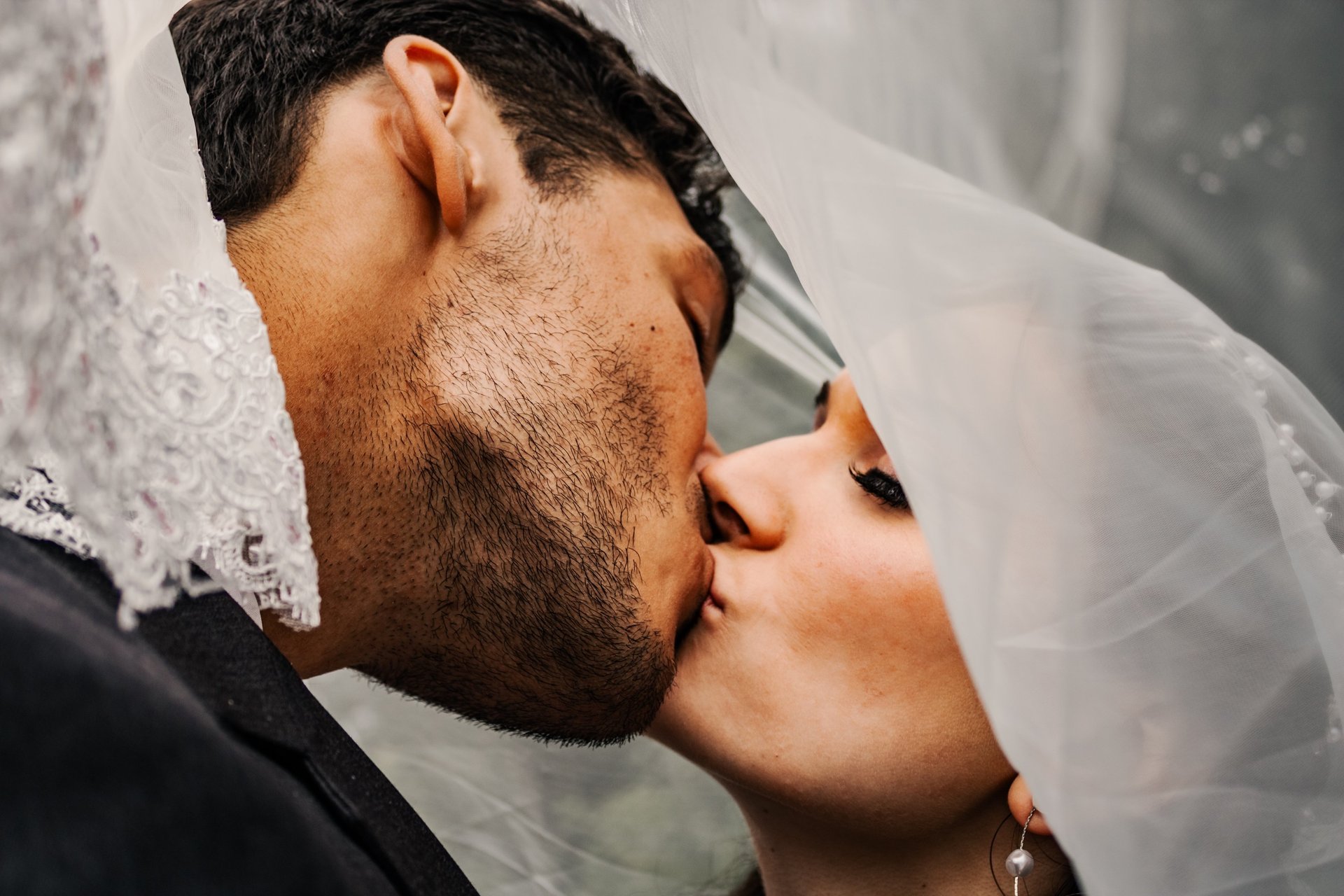bride and groom portrait, kissing, under the veil shot