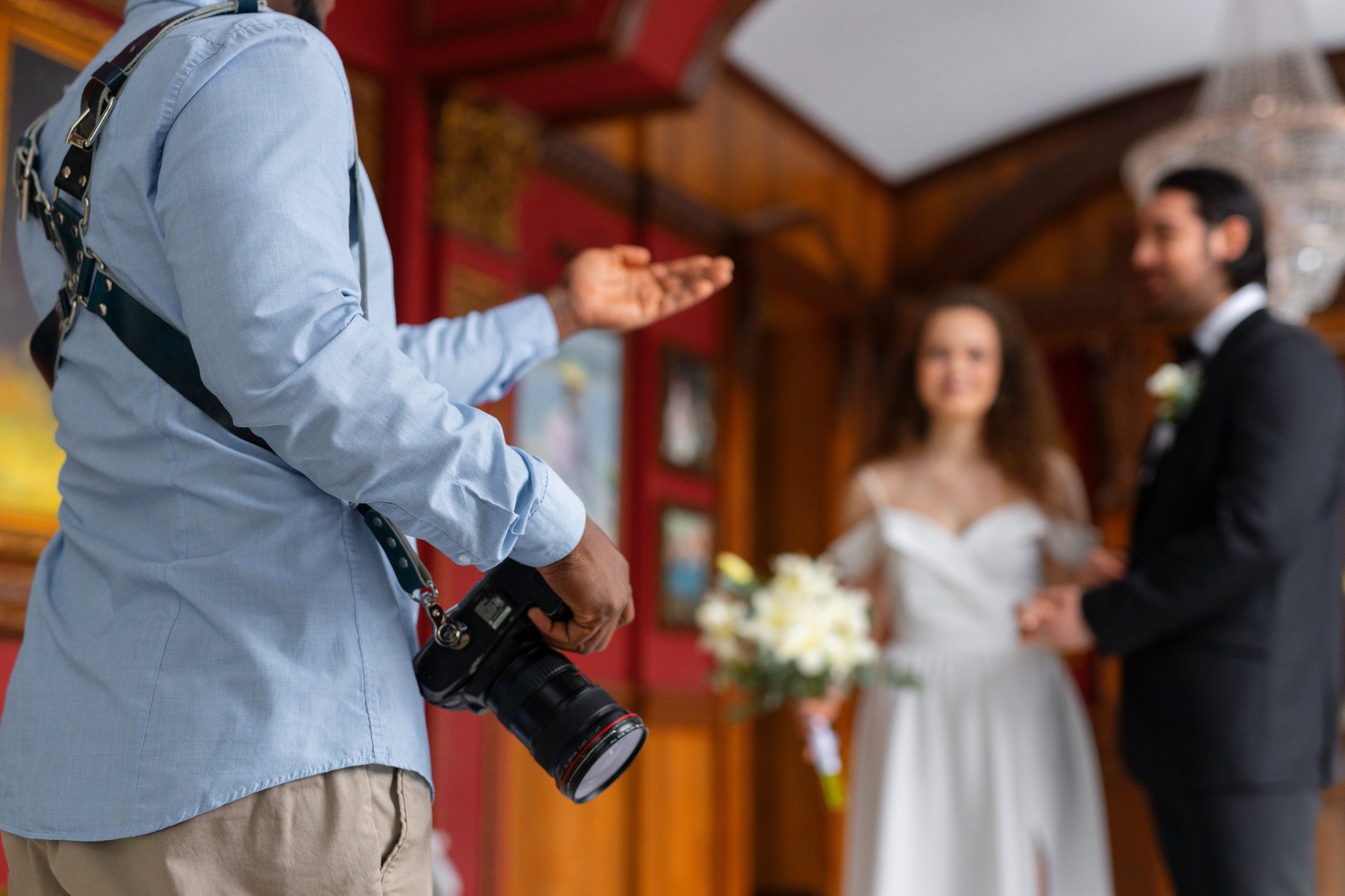 a man in a suit and tie is holding a camera